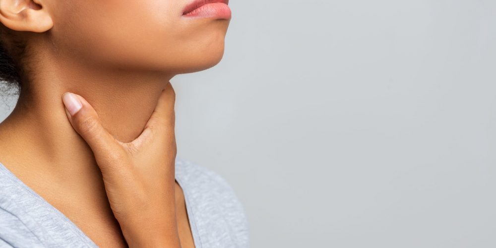 Cropped of afro woman touching her neck, having pain in throat, free space
